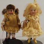 Two Miniature All-Bisque Dolls With Dome
