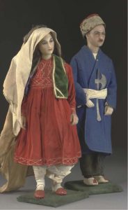 A pair of wax-headed figures depicting members of the Ottoman Empire